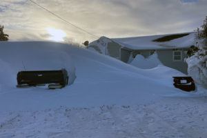Snow buried vehicles
