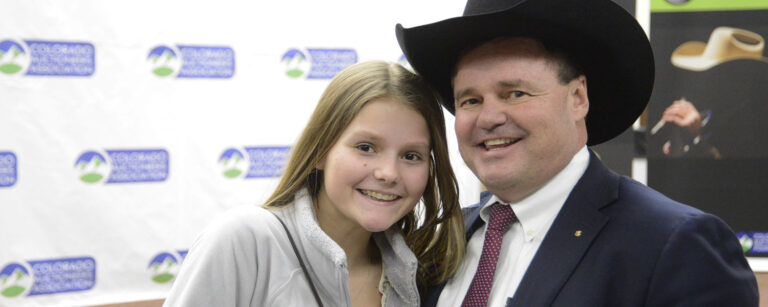 Scott and his daughter at an auction