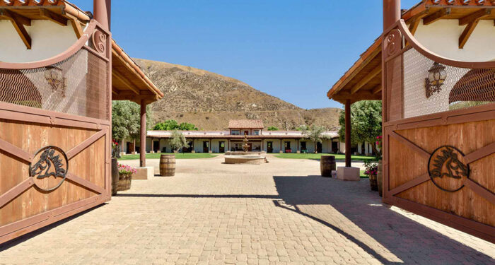 impressive equestrian building entrance between gates
